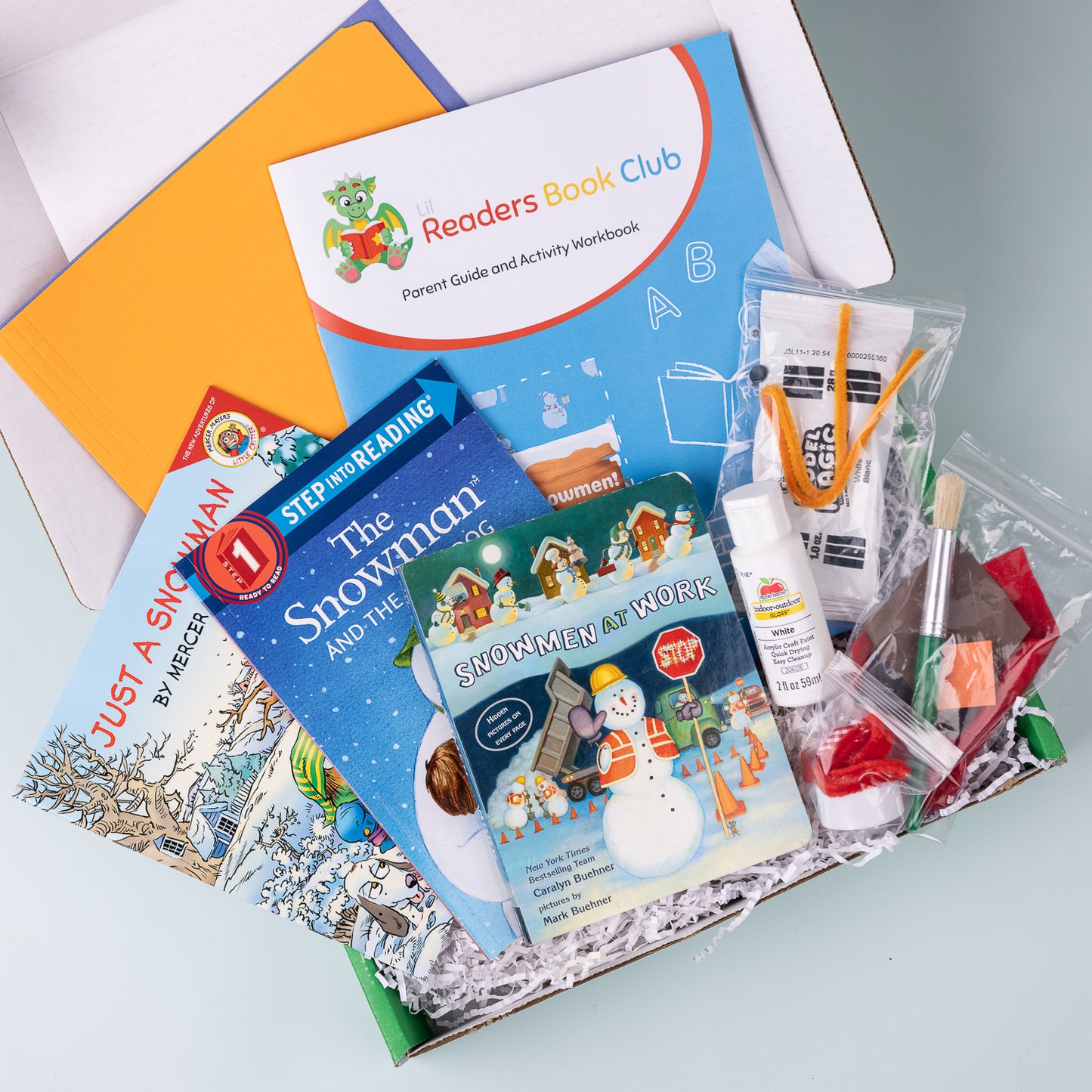 Snowman themed book subscription for kids ages 5-7, filled with books, crafts, activities and materials for fun learning.