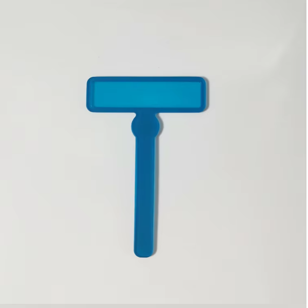A blue highlighter with a rectangular body and a visible tip, placed against a white background.